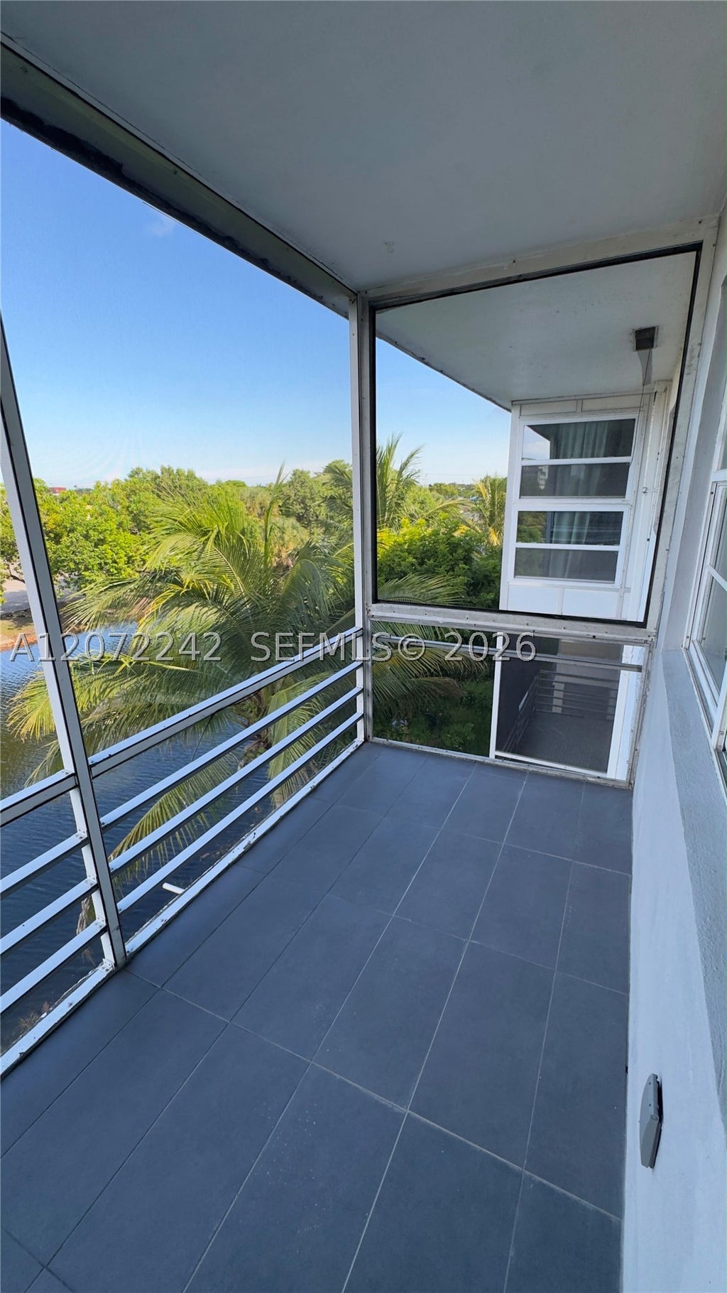 Photo of 1280 NW 43rd Ave #303, Lauderhill, FL 33313 (MLS # A12072242)