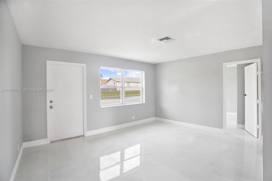 Beautifully renovated DUPLEX situated on a CORNER LOT in the heart of Riviera Beach! This move-in ready two-unit property features 2-bedroom, 1-bath units, each offering a bright, open layout with polished porcelain tile flooring throughout and fresh neutral paint. Each unit includes an updated kitchen with white shaker cabinets, granite countertops, and stainless steel appliances.Both bathrooms have been fully remodeled with modern vanities, walk-in showers, and large-format wall tile. Spacious bedrooms provide a clean, airy feel, and large windows allow for abundant natural light. The roof has over 10 years of useful life remaining, offering added value and peace of mind.
Each unit has designated parking, plus additional street parking available. No HOA. Conveniently located just minutes from Peanut Island, Riviera Beach Marina, beaches, shopping, dining, and major highways.
Ideal for owner-occupants or investors seeking a turn-key duplex!