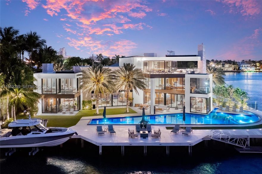 Where extraordinary scale meets one of Harbor Beach’s most coveted waterfront settings. Set on a premier Intracoastal point lot with nearly 300 feet of water frontage within the guard-gated Harbor Beach community, this exceptional estate offers an extraordinary level of South Florida waterfront living. Spanning over 11,700 square feet across three levels, the residence blends timeless architecture with modern sophistication.

Light-filled interiors feature soaring ceilings, marble and wood flooring, and beautifully crafted finishes throughout. Designed for both grand entertaining and comfortable everyday living, the home offers six bedrooms, eight full baths, and one half bath. Notable features include four fireplaces, six wet bars, a commercial-grade elevator, advanced security, and integrated smart-home technology.

A dramatic third-floor lounge captures sweeping Intracoastal views, creating an ideal setting for entertaining or relaxed evenings overlooking the water. Walls of glass and expansive terraces enhance the connection between the interiors and the surrounding waterfront.

Outdoors, the property unfolds as a private resort-style retreat, highlighted by an approximately 90-foot infinity-edge lap pool, expansive sun terraces, and a private dock with direct ocean access. Located within the prestigious Harbor Beach community, residents also enjoy access to a private beach club, moments from the dining, shopping, and yachting of Las Olas.