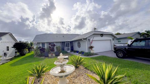 Photo of 7112 NW 107th Ave, Tamarac, FL 33321 (MLS # A12065781)