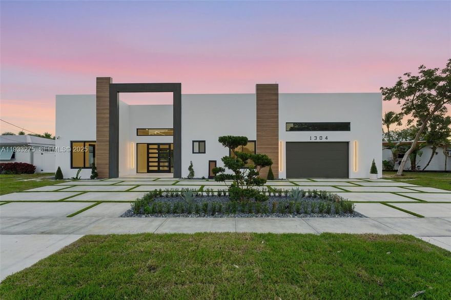 Welcome to SEABREEZE, a boutique waterfront masterpiece offering refined coastal living with direct ocean access. This brand-new 2025 custom residence features 3 bedrooms, 3.5 bathrooms, and 2,223 square feet of thoughtfully designed living space, crafted over two years with meticulous attention to detail, premium materials, and all permits in place.

Designed for both entertaining and everyday living, the one-story floor plan showcases soaring 12-foot ceilings, elegant European Padron tile flooring, and an abundance of natural light throughout. The chef’s kitchen is appointed with Thermador stainless steel appliances, custom European-style cabinetry, and sleek modern finishes. Spa-inspired bathrooms feature DAX shower panels, while LED lighting, linear A/C vents, and high-end construction elevate the home’s modern aesthetic.

Enjoy seamless indoor-outdoor living with a hardwood ceiling covered back porch overlooking the canal. Situated on an 8,028 SF lot with 41 feet of waterfront, the property offers direct water access, a private dock, seawall, and one fixed bridge—ideal for boating or jet skis. Additional features include a private entrance flex suite, attached one-car garage, concrete circular driveway with ample parking, and golf cart parking.

Located east of Federal Highway with quick access to I-95, this exceptional waterfront home delivers luxury, functionality, and the ultimate South Florida lifestyle.