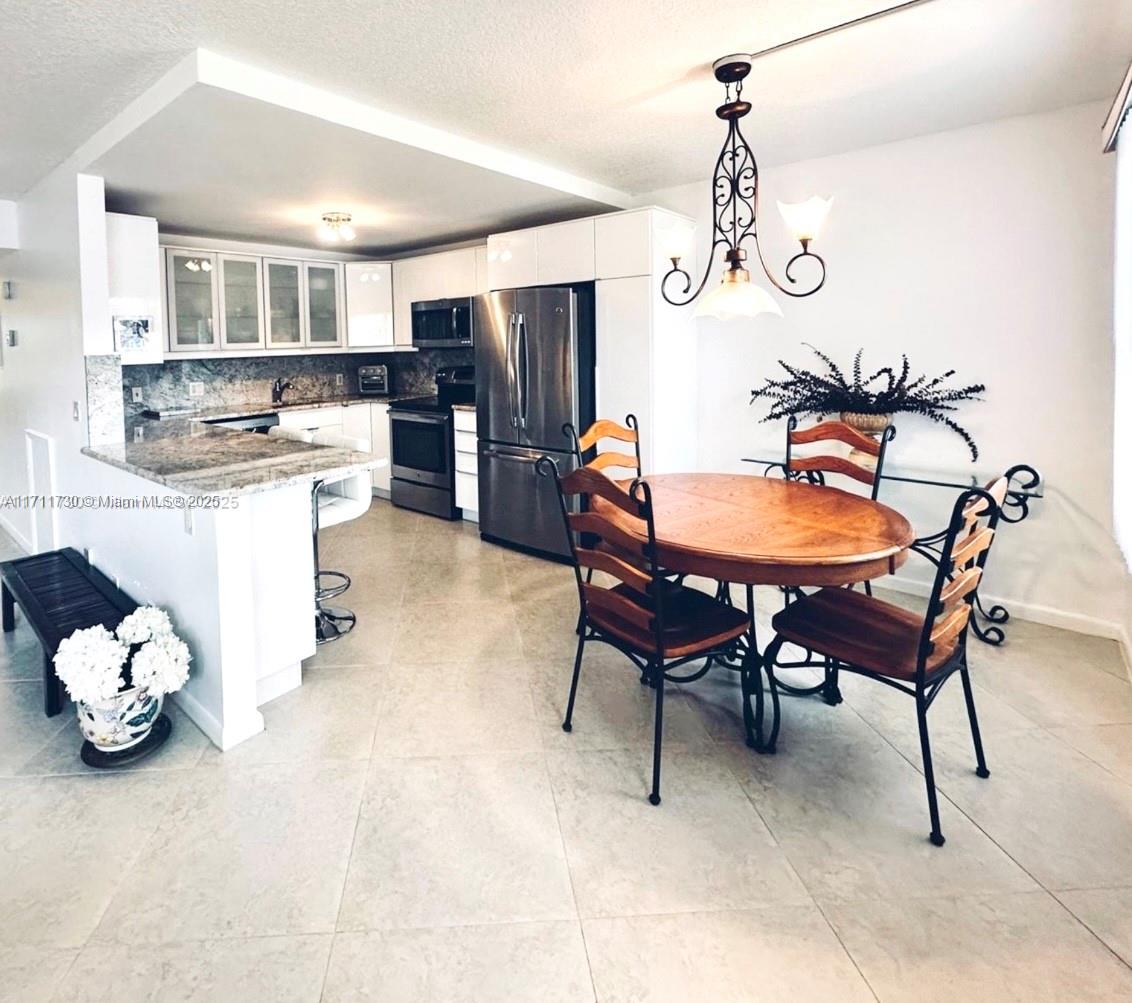 Seller Financing available. Fully upgraded, freshly painted & beautifully maintained, this ground-floor condo offers a scenic view of the lake & private garden. BRAND NEW ELECTRICAL PANEL. Remodeled kitchen with space for everything! Pantry with pull-out shelves, deep drawers. Over-mount & under-mount lighting, stainless steel appliances, hidden storage under the countertop. Upgraded bathrooms & flooring. AMAZING CLOSET SPACE in all 4 closets: 2 walk-ins, linen, hallway + a large patio storage room. Parking space is in front of your door, giving a true home-like feel. Plenty of guest parking. Community features: Guard-gated, 24/7 security & shuttle bus service. Clubhouse, theater, swimming pools, putting green, fishing pier, gym, library, tennis & pickleball, to name a few.