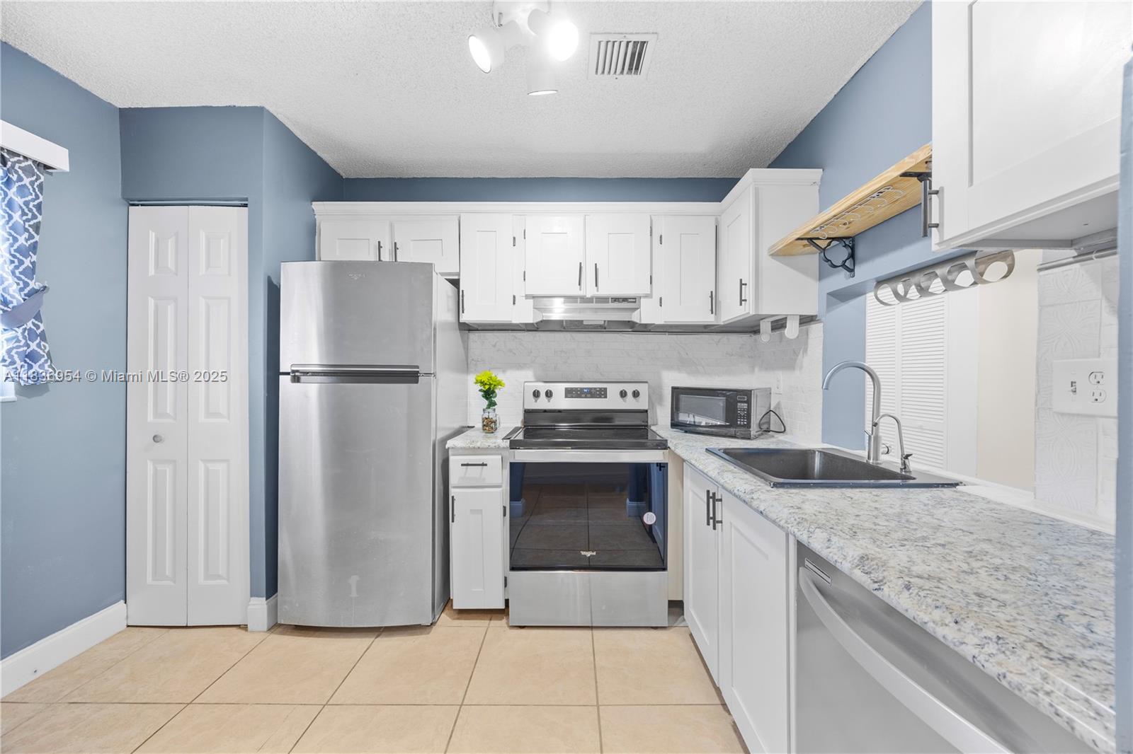 Step into this bright and secure Margate condo, located on the second floor entrance, offering 2 spacious bedrooms and 2 modern bathrooms. You'll love the peace of mind provided by hurricane impact windows and doors, as well as the extra storage space found on the balcony. Inside, the updated kitchen opens up to tile-floored living areas, perfect for relaxing or entertaining. Both bedrooms feature low-maintenance laminate flooring, and the renovated bathrooms bring a stylish touch. An in-unit washer and dryer add everyday convenience. Located just minutes from major shopping centers, restaurants, and easy access to the Turnpike — this home blends comfort, function, and location. Come see it today!