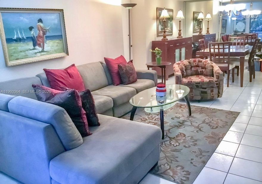 Welcoming apartment in excellent condition, featuring an open-concept layout and a spacious balcony. The cheerful, modern remodeled kitchen enhances the overall appeal of the home. Ideally located, the property includes the convenience of two assigned parking spaces. The community offers desirable amenities such as a swimming pool, tennis court, 24/7 security, and a gated entrance with perimeter fencing.