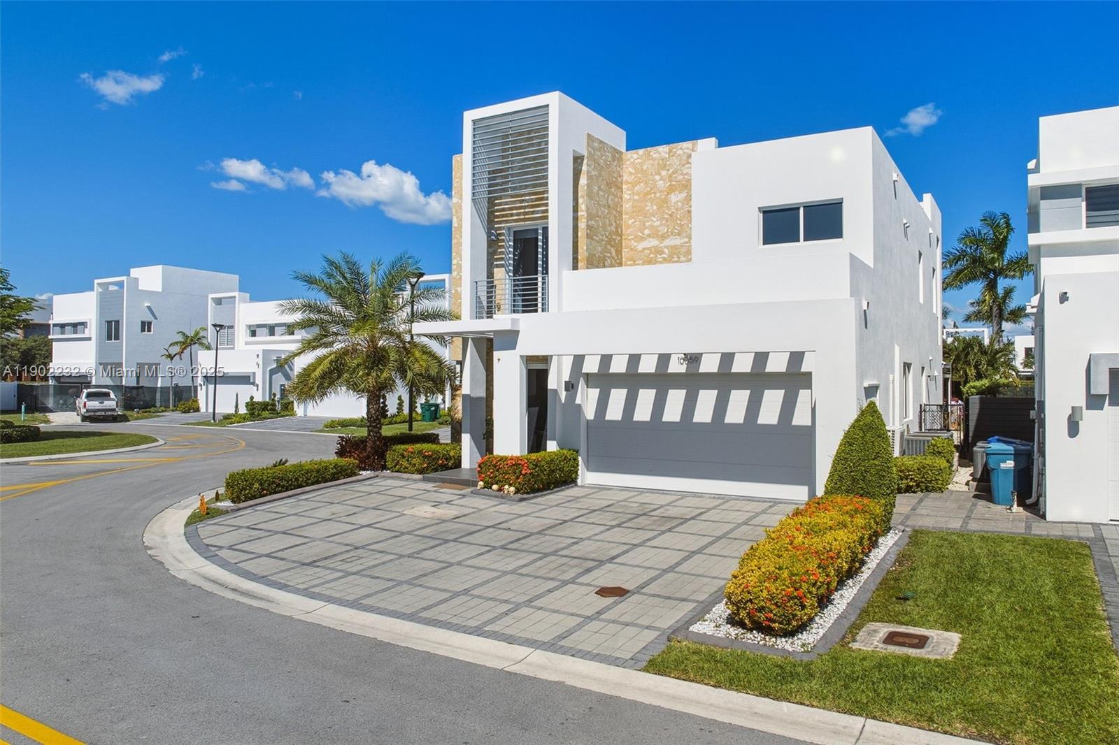 Elegant 4-bedroom, 3.5-bath pool home in Neovita, set on one of the largest lots in the community with 5,597 sq ft of land. This 2,782 sq ft residence features a modern open layout with a quartz kitchen, premium appliances, and refined finishes. Includes one bedroom on the first floor with private bath and side entrance, plus an upstairs master suite with large walk-in closet and terrace. Another bedroom also has its own terrace and walk-in closet. Porcelain floors, wood upstairs, high ceilings, and impact windows. The garage was partially converted into a playroom or gym, keeping space for one car. The saltwater pool enhances a beautiful patio with covered area and BBQ space. Gated community with cable, internet, and 24-hour security.