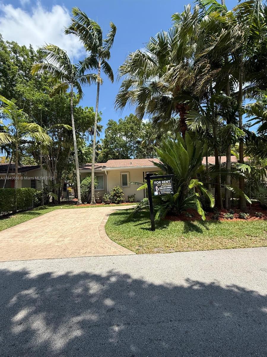 Prime location in the heart of Pinecrest: exceptional unit available for rent, featuring 2 bedrooms, 2 bathrooms, and approximately 990 SF of living space plus a spacious 990 SF PRIVATE fenced backyard. Highlights include newly polished terrazzo floors, a fully renovated kitchen with quartz countertops, premium stainless steel appliances, generous bedrooms, and in-unit washer/dryer. The blinds are currently being replaced with sleek new screens, and updated photos will be available soon. Conveniently located with easy access to major highways and shopping centers. Unit available for immediate viewing — TEXT LISTING AGENT TO REQUEST VIDEO TOUR.