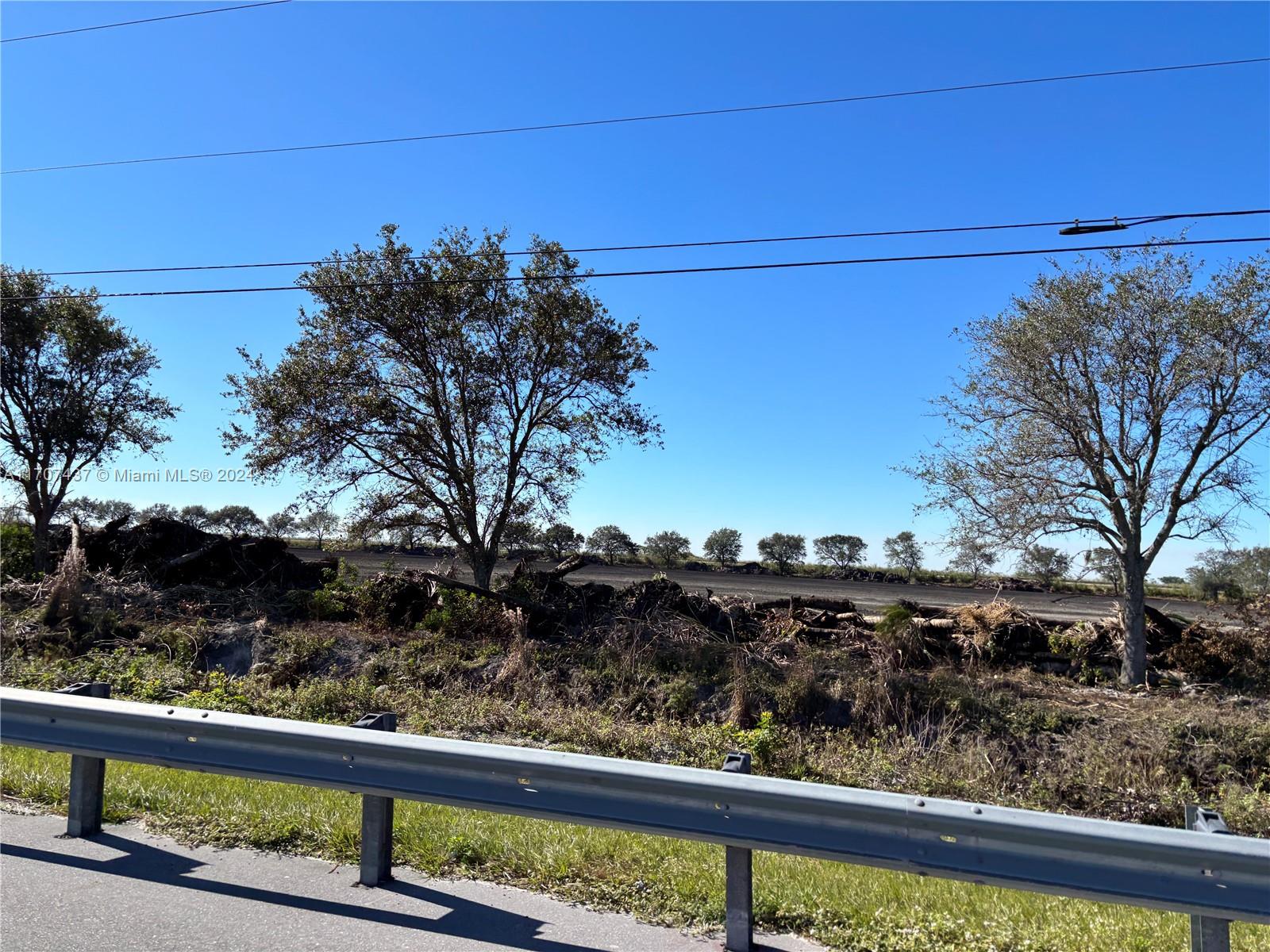 We are pleased to present this unique 28.48 SOD FARM surrounded by oaks with 1834 SF Highway frontage along US Hwy 27. Lake Harbor. Palm Beach Co/unincorporated. Zoned AG Production (AP). Land Use Code 6900 Ornamental/MISC AG. Rich, fertile muck land, rarely found. Instructions and care of this farm are very simple. Pump & irrigation on site. This property is in an IRS Qualified Opportunity Zone (IRS QOZ). There are home sites along Corkscrew Blvd, with electricity, fiber optic and municipal water supply. All PAVED ROADS. Please call for an appointment & to enter the property.