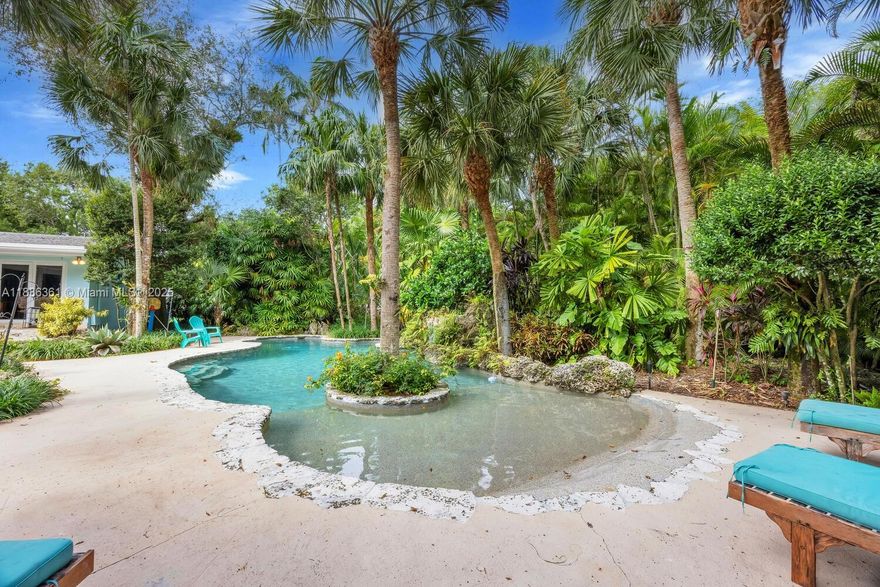 Stunning Tropical Garden Acre (+/-). LAND VALUE SALE. Currently features a 1957 house with 4BR+Office+ 3BA+2CGarage with 4,182sf under roof and a charming 2BR+1BA+1CGarage Guest house with 1,794sf under roof built in 2010 with a metal roof, impact doors and windows, and a beautiful Resort-style Pool with beach entry. Highest and Best use of the property would be to raze the main house and preserve the guest house. A conceptual master plan is available to help you create your dream home. Room for a tennis court. Located in Flood Zone “X” on a beautiful, quiet street in South Pinecrest with mature and exotic foliage. Motivated sellers!