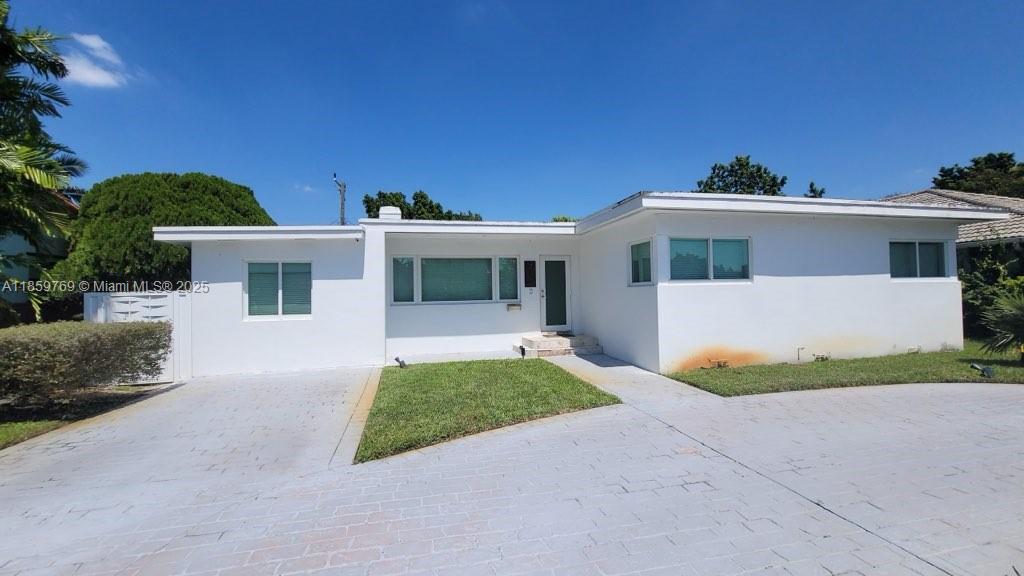 Remodeled 4-bedroom home in Beautiful Miami Springs. Modern style with impact windows, new roof, new AC, updated kitchen and baths. Tenant Occupied until October 15th.
