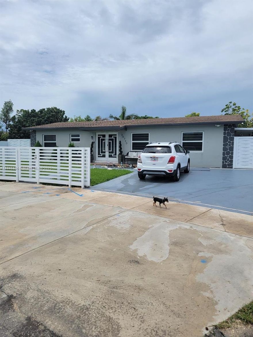 A HOUSE FOR A SPECIAL FAMILY!!!!Don't miss this one! A great forever family home boasting updated kitchen, 4 large bedrooms/2 baths, all tiled, huge family room, screened patio, working hot-tub, 2016-new roof, and huge fenced lot with mature fruit-bearing trees and lots of room for a pool. Hurricane shutters. Easily qualifies for Conventional, FHA or VA financing.