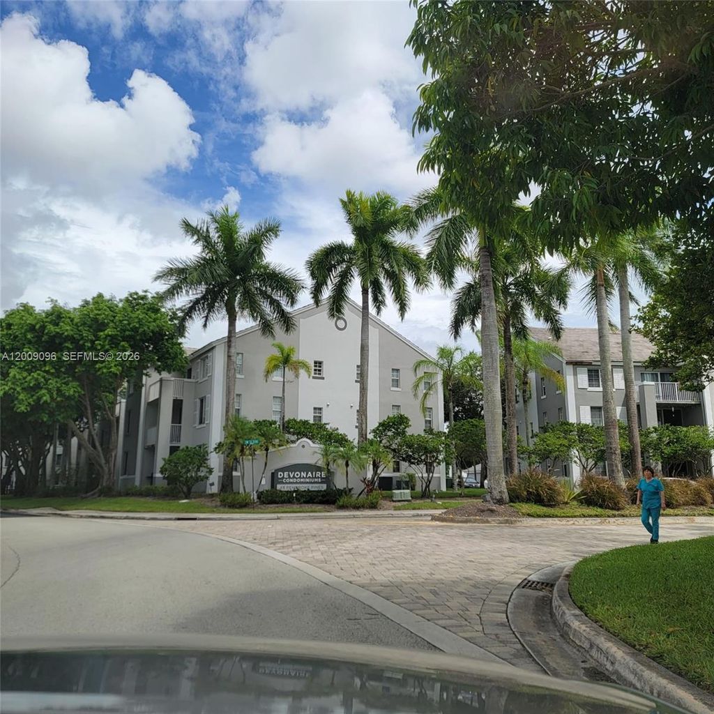 Photo of 711 SW 111th Way #301, Pembroke Pines, FL 33025 (MLS # A12009096)