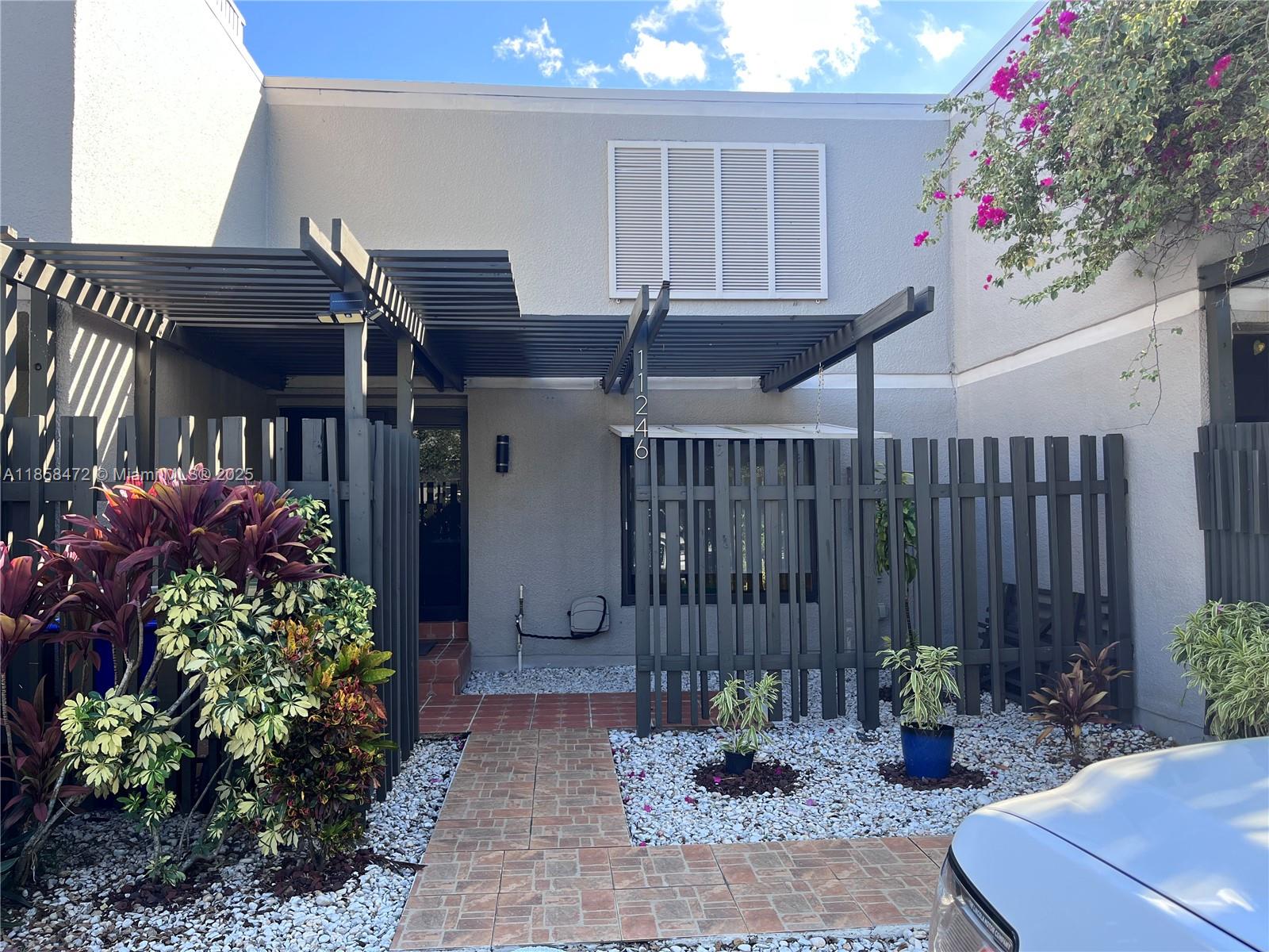 Must see this beautiful 3 bedrooms, 2 1/2 baths townhouse in Village Lakes. Perfect blend of confort & style. Open-concept layout. Breathtaking lake view. Freshly painted. Bright, airy and spacious living areas with plenty of natural light. Nice open kitchen with snack bar. Plenty of cabinets, marble countertops, & stainless steel appliances. Recently remodeled bathroom, add a modern touch. Full size washer & dryer. Ceramic title downstairs & laminated upstairs. Large screened patio. Hurricane impact windows, door, & accordion hurricane shutters in the family room area. 2 assigned parking spaces plus guest parking. Community offers: clubhouse, pool, tennis courts, & exercise room. Conveniently located near school, supermarkets, gas stations, banks, restaurants, & shopping centers.