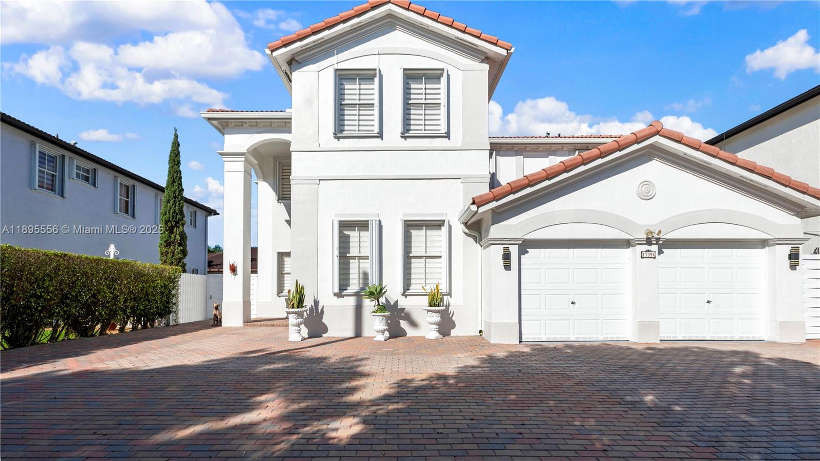Spacious two-story single-family home with over 3,000 sq ft of living area in desired Century Gardens in the heart of Miami Lakes, NO HOA approval required, this property is ready for move in. Freshly painted all white, Features a full bedroom and bath downstairs, huge kitchen with island and stainless-steel appliances, built-in closets, and zebra blinds. Enjoy a large driveway, two-car garage with A/C, and a fenced backyard with pergola and storage shed. Prime location close to schools, shopping, and highways. Don't miss this opportunity!