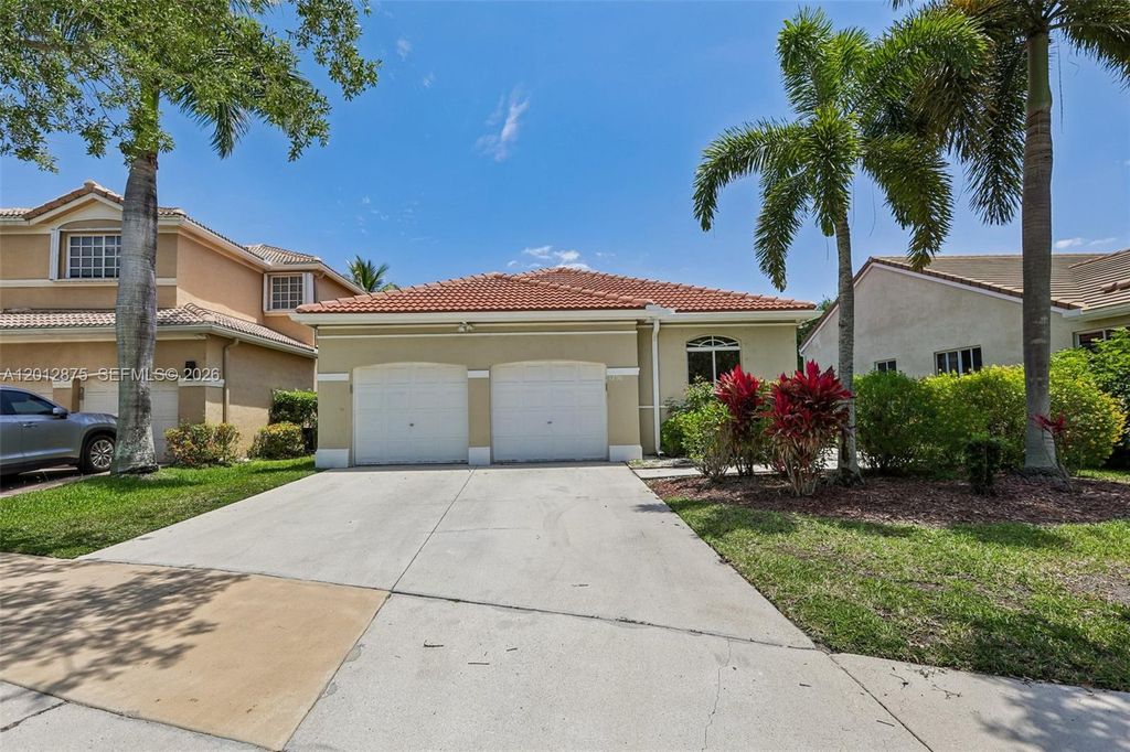 Photo of 1290 Camellia Ln, Weston, FL 33326 (MLS # A12012875)