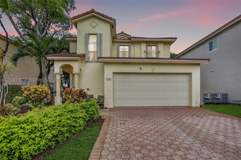 Photo of 1605 SW 158th Ave, Pembroke Pines, FL 33027 (MLS # A12103974)