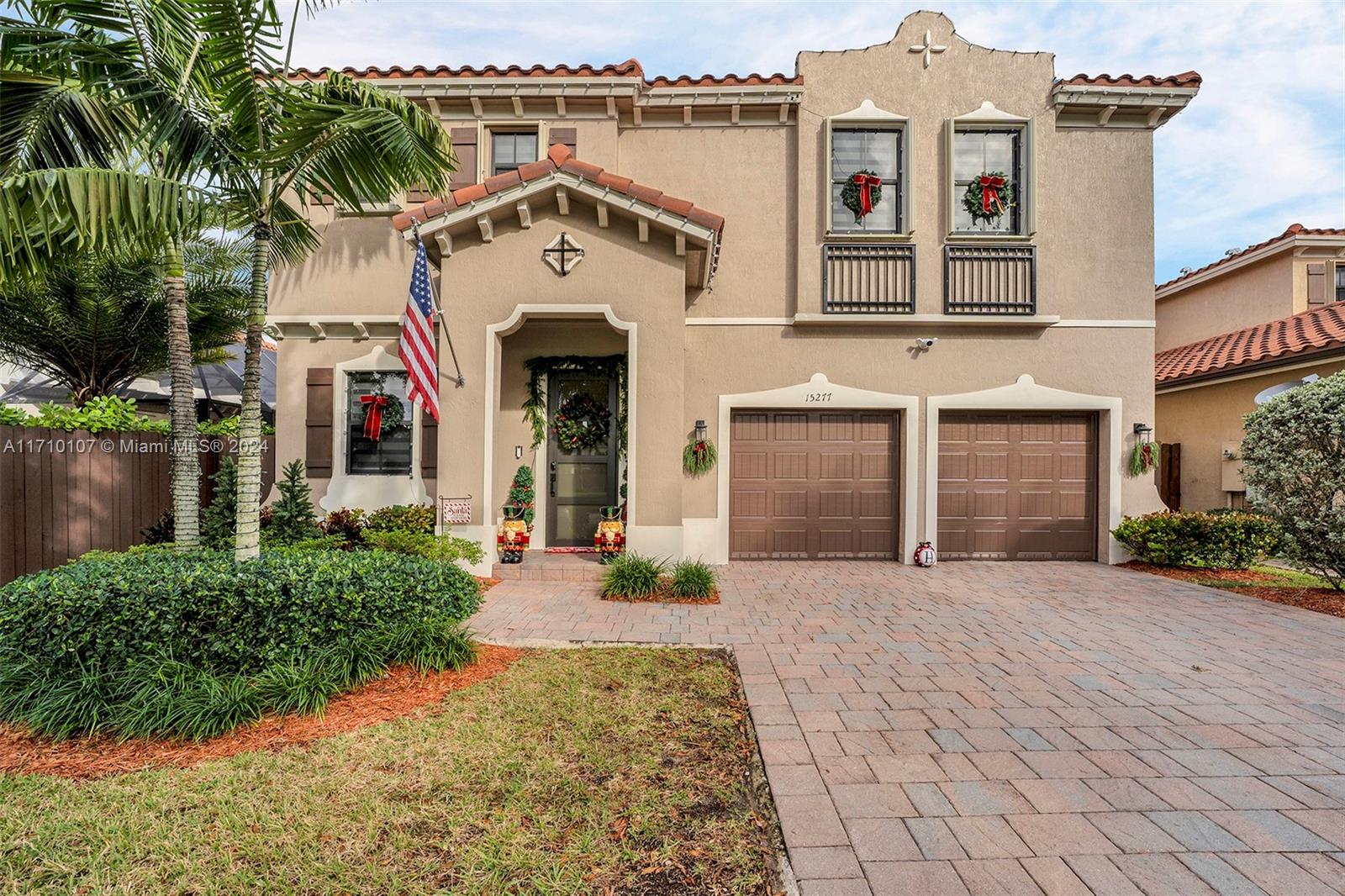 This beautifully maintained home offers modern upgrades and thoughtful details inside and out. Features include a soft-washed roof, new exterior paint, sealed pavers, zebra blinds, and new hallway and staircase flooring with 9-ft ceilings. The kitchen shines with brand-new appliances, including a stove, dishwasher, microwave, and refrigerator, while an EcoSmart hot water heater adds efficiency. Hurricane-ready with accordion shutters upstairs and panels downstairs, it’s located across from the clubhouse, pool, and gym. Additional highlights include a spacious two-car garage with openers, audio/video cameras with lighting, a new hurricane impact front door, and a patio complete with a mounted TV, perfect for entertaining. Schedule your tour today to experience all this home has to offer!