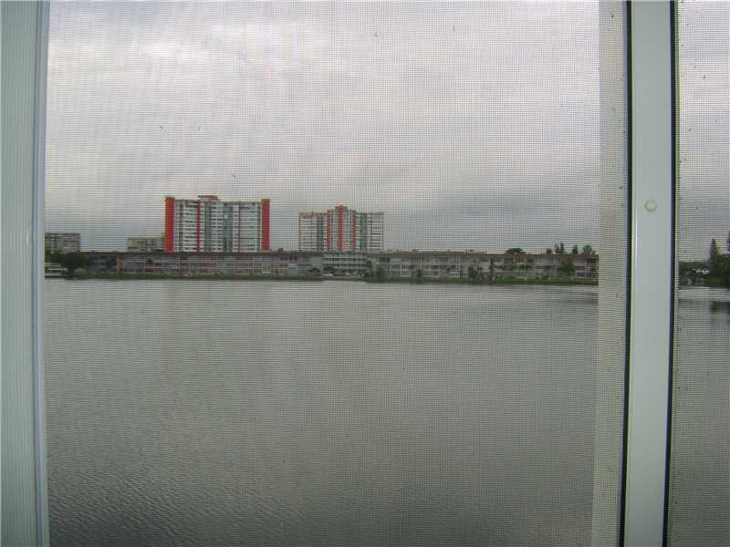 HUGE STUNNING ROYALE 2/2 1674 FT. BEST LAKE VIEWS IN ALL JADE WINDS FROM 2 TERRACES. EXTRA FREEZER. TILED FORMAL DINING ROOM AND LIVING ROOM. MASTER BEDROOM IS CARPETED. SELL AS-IS. EXCLUDE DINING RM CHANDELIER. GATED COMMUNITY. GREAT LOCATION. WALK TO SH OPPING. BUYER ASSUMES SPECIAL ASSESSMENT AT CLOSING $48.81/7 YEARS.RENT AFTER 2 YEARS.