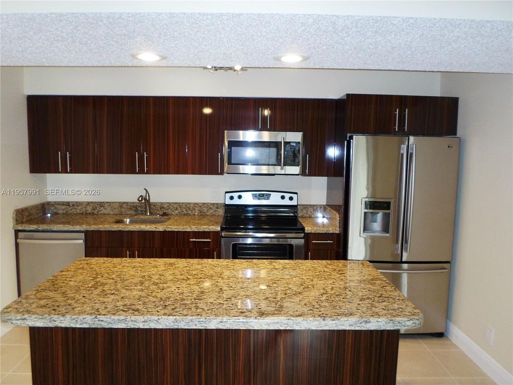 Photo of 4055 W Mcnab Rd #H311, Pompano Beach, FL 33069 (MLS # A11957991)