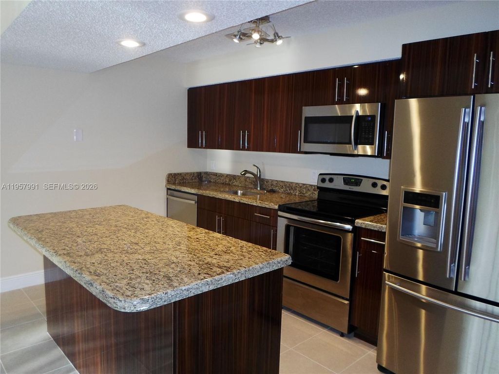 Photo of 4055 W Mcnab Rd #H311, Pompano Beach, FL 33069 (MLS # A11957991)