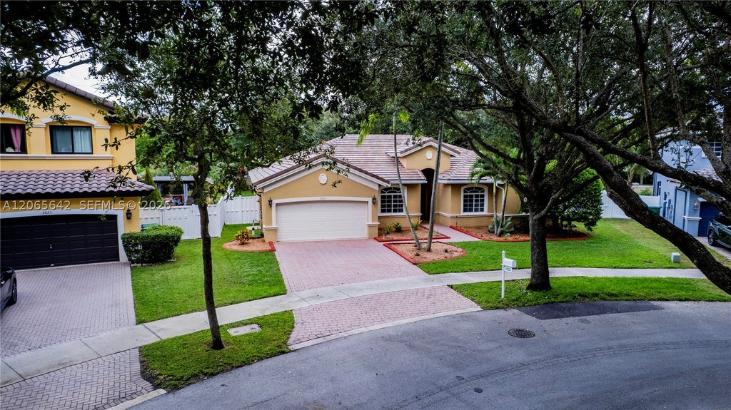 Photo of 2823 Poinciana Cir, Cooper City, FL 33026 (MLS # A12065642)