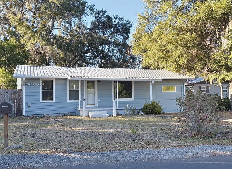 Downtown High Springs rental. Walking distance to shops, restaurants and close to Springs, Santa Fe River and outdoor recreation. Cute and well maintained 2/1, approximately 1,200 sf on a 9,500 sf fenced lot with large flex space that can be used as an additional bedroom, home office or additional living space. Enclosed carport with private entrance can be used as studio space, storage or home office, utility room with full size washer and dryer, full house water filtration system, gas stove, newer appliances, screened back porch, backyard shed. Freshly painted. One year minimum Lease. Owner/Agent Background Check and Credit Report required. Tenant pays for electric, gas and water.