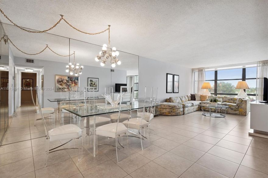 Investors welcomed! Buy and rent right away.  Light and bright, 1075sf, 1BR/1.5BA + den or possible 2nd BR in waterfront building in quiet area of Hallandale Beach, not far from the beach, parks & shops.  Great bicycling area.  The unit features all white tile in the main areas and the den area can be converted to a sleep area.  The enormous master bedroom with wood floors easily fits a king size bed with room to spare. Nice custom closets and a separate storage unit. Great community amenities feature a waterfront pool and barbecue areas, clubhouse with gym and a tennis court. A great place to call home!