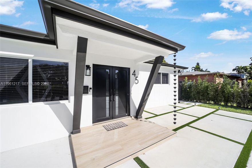 Beautifully reimagined and fully renovated North Miami single-family residence offering style and indoor-outdoor living. This bright, open, airy-concept home features 1,931 sq ft of adjusted living area (2,073 sq ft total) on a 7,500 sq ft lot, recently upgraded with professional design and quality finishes.

The layout includes three bedrooms plus an expansive family room, currently used as a music studio and adaptable as a fourth bedroom, large office, studio, or family room. The home also features formal living and dining areas, an updated kitchen with newer high-end appliances, and a dedicated laundry room with window and full-size side-by-side washer and dryer.

The residence offers two full interior bathrooms plus an outdoor half bath. Step outside to a large covered and enclosed patio overlooking lush natural grass, with easy access to a stunning heated pool for year-round enjoyment.

Major upgrades include all impact windows and doors, including the front door, new roof, plumbing, electrical, water heater, pool heater, air conditioning, rain gutters, new front façade, driveway, recessed LED lighting, fencing, sprinkler system, landscaping, new natural grass front and back, added side storage shed, exterior camera system, and non-flood zone location.

Move-in ready and well maintained, this home is in a quiet, residential, family-oriented neighborhood close to I-95 and Biscayne Blvd, minutes from Aventura, Bal Harbour, beaches, shopping, dining, and airports.