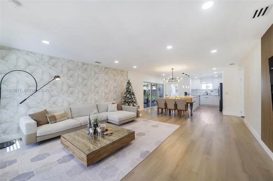 Beautifully reimagined and fully renovated North Miami single-family residence offering style and indoor-outdoor living. This bright, open, airy-concept home features 1,931 sq ft of adjusted living area (2,073 sq ft total) on a 7,500 sq ft lot, recently upgraded with professional design and quality finishes.

The layout includes three bedrooms plus an expansive family room, currently used as a music studio and adaptable as a fourth bedroom, large office, studio, or family room. The home also features formal living and dining areas, an updated kitchen with newer high-end appliances, and a dedicated laundry room with window and full-size side-by-side washer and dryer.

The residence offers two full interior bathrooms plus an outdoor half bath. Step outside to a large covered and enclosed patio overlooking lush natural grass, with easy access to a stunning heated pool for year-round enjoyment.

Major upgrades include all impact windows and doors, including the front door, new roof, plumbing, electrical, water heater, pool heater, air conditioning, rain gutters, new front façade, driveway, recessed LED lighting, fencing, sprinkler system, landscaping, new natural grass front and back, added side storage shed, exterior camera system, and non-flood zone location.

Move-in ready and well maintained, this home is in a quiet, residential, family-oriented neighborhood close to I-95 and Biscayne Blvd, minutes from Aventura, Bal Harbour, beaches, shopping, dining, and airports.