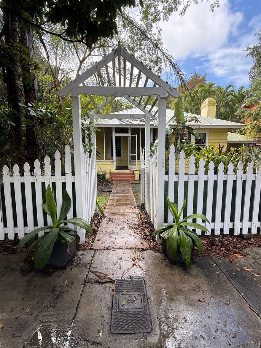 Discover the rare opportunity to rent a classic South Coconut Grove cottage set on an extraordinary 14,489 SF lot — one of the largest in the neighborhood. This charming 1936 residence offers 2 bedrooms, 1 bathroom, and 900 square feet of cozy, character-filled living space, surrounded by lush, mature tropical landscaping that provides exceptional privacy. Inside, you'll find a bright and intimate layout with all major appliances included — washer, dryer, dishwasher, refrigerator, and electric range — making this a true move-in ready home. Central air conditioning keeps you cool year-round. The true crown jewel is the expansive outdoor grounds — a rare, sprawling canvas in the heart of the Grove, perfect for outdoor entertaining, gardening, or simply enjoying the South Florida lifestyle in total seclusion. Located just minutes from CocoWalk, Peacock Park, world-class dining, boutique shopping, marinas, and top-rated schools — all tucked away on one of the Grove's most tranquil, tree-canopied streets.