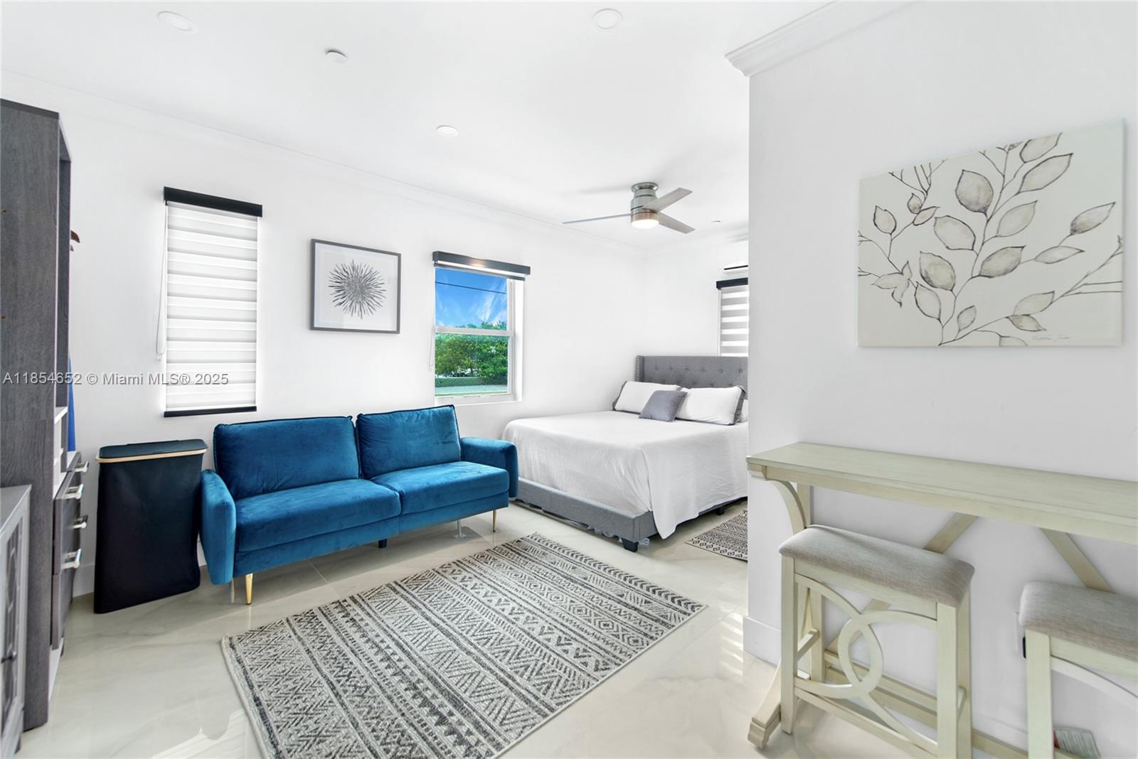 Discover this fully furnished and equipped apartment, ready for you to move in. Located at Mile Marker 98 in Tavernier, this unit offers an unbeatable location with direct exposure on the Overseas Highway. The building recently underwent over $100,000 in furnitures, including brand-new appliances and top on the line equipment in each unit. The building is a hub of activity, with popular businesses like a hair and nail salon, a pizzeria, and a doctor's office. A food truck and ice cream shop are also coming soon, attracting plenty of foot and car traffic.