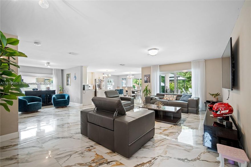 4-bedroom 2-bath Single Family Home with two garage, pool & canal. Located in the heart of Coral Springs.  Circular driveway can easily park 8+ cars. Gated front porch for private enjoyment. Upon Entrance, your greeted with a seamless open floorplan. New large format tile flooring throughout the main areas. Spacious Livingroom & dining with lots of natural lighting. All impact windows with sliding blinds as an added feature. Renovated kitchen with unique finishes & stainless appliances. Down the hallway is your bedrooms with wood flooring and updated baths. Washer/Dryer in the garage. BRAND New A/C. Fully fenced backyard with pool, brand-new Gazebo & pool deck. Great Location! Close to Sawgrass Exp, Golf course, local shops & parks. EASY TO SHOW! Call for an exclusive showing!