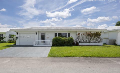 Photo of 7100 NW 66th Ter, Tamarac, FL 33321 (MLS # A12063725)