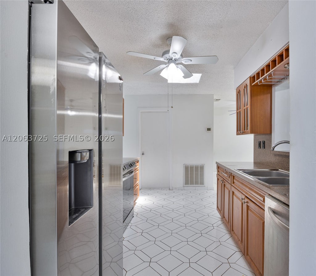 Photo of 7100 NW 66th Ter, Tamarac, FL 33321 (MLS # A12063725)