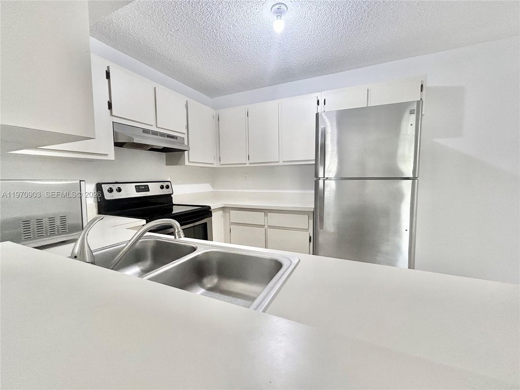Photo of 400 W Palm Cir W #201, Pembroke Pines, FL 33025 (MLS # A11970903)