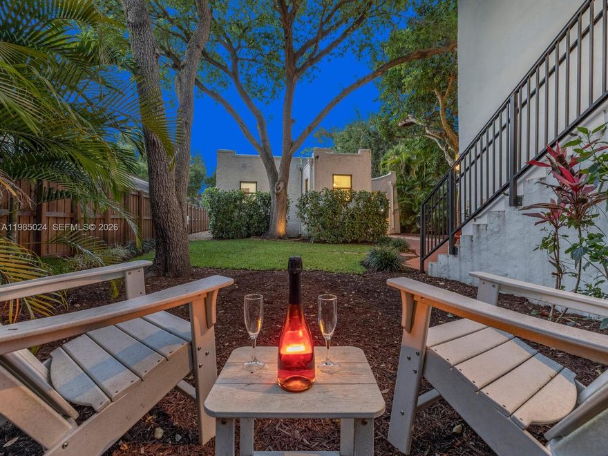 One property. Three distinct living spaces—a main house plus a two-story guest house with two separate guest units! Welcome to Villa Serenata—a rare 1925 Mission-style compound in Miami Shores offering a 3BD/2BA main residence and a detached two-story casita with TWO fully independent units—ideal for multigenerational living, guests, home office, fitness, or more. Much like a serenade drifting through the evening air, this romantic Mediterranean-inspired retreat unfolds with graceful rhythm, warmth, and timeless architectural detail. The 1,463 SF main home features bamboo wood floors, a sun-filled Florida room perfect for a lounge or office, and a living room with original fireplace and elegant columned archway leading to the formal dining area. The updated kitchen includes marble countertops, a breakfast bar, and a bright window-wrapped breakfast nook. Outdoors, enjoy a lush oak-canopied entertaining oasis with an entertainment esplanade, plenty of green space, and room for a pool. The 800 SF two-story casita offers two separate legal “apartments” with updated baths and kitchenettes plus storage. All in a fantastic non-flood zone location, just blocks to Downtown Miami Shores.