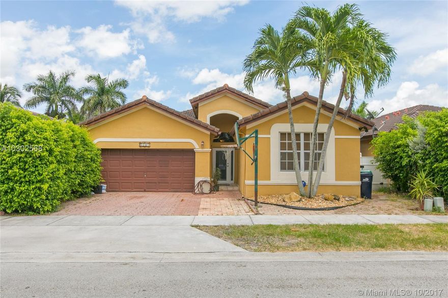 Nestled in this established quiet  Shoma Homes community, this spacious 3/2- plus 2-car garage home is perfect for your growing family.  Home was originally a 4 bedroom, but two bedrooms were converted into one large bedroom suite- can easily be converted back to a 4th bedroom. Large living, kitchen, and outdoor space are ideal for South Florida living and entertaining.  Master suite is a retreat boasting large walk-in closets and master bath. Check out our video of the home on YouTube by typing in the address. Schedule a showing before this opportunity!
