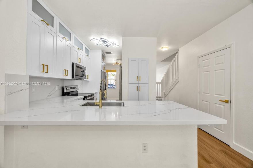 Welcome to your turn-key home in The Isles at Oasis! This home features quality renovations, new kitchen appliances and a tankless water heater, all from early 2024. The home also includes complete accordion shutters. Lots of natural light peers through the windows during the day, making for beautiful illumination inside. Ample parking in front of the unit allows for seamless hosting. The HOA payment includes clubhouse access, which boasts an extensively renovated facility. The clubhouse has a massive pool, an excellent gym, a jacuzzi, a splash pad and shallow pool for kids. It also has a large space available for owners to rent out for parties and other events.