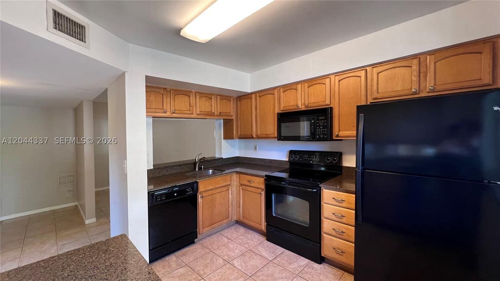 Photo of 757 NW 92nd Ave #757, Plantation, FL 33324 (MLS # A12044337)