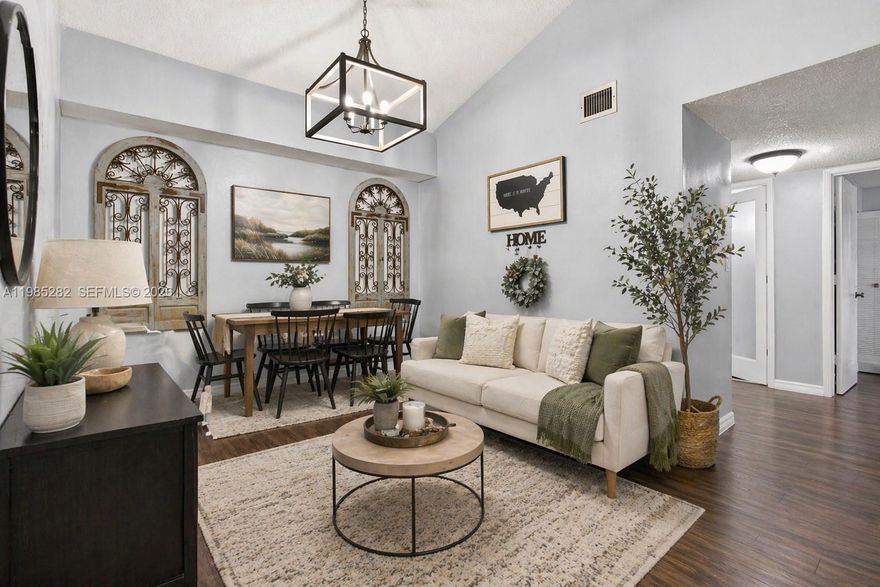 STUNNING CORNER UNIT WITH VAULTED CEILINGS & OPEN LAYOUT! Light-Filled Condo Featuring Soaring Ceilings and an Open-Concept Living/Dining Area Ideal for Everyday Living and Entertaining. Kitchen Flows Seamlessly into Main Living Space. Newer Flooring Throughout, Spacious Bedrooms, and Updated Bathroom with Modern Vanity.

Private Screened-In Balcony with Storage Closet—Perfect for Relaxing. Primary Suite Offers Walk-In Closet + Attic Access for Extra Storage. Generously Sized Second Bedroom with Flexible Use.

Additional Features Include Newer Full-Size Washer & Dryer In-Unit, Newer A/C System, and Accordion Hurricane Shutters.

Located in a Pet-Friendly, All-Ages Community with Pool, Clubhouse, Fitness Center, and Tennis Courts. Centrally Located Near Parks, Major Highways, Beaches, Shopping, Dining, and Airports.

Move-In Ready and Easy to Show—Schedule Your Tour Today!