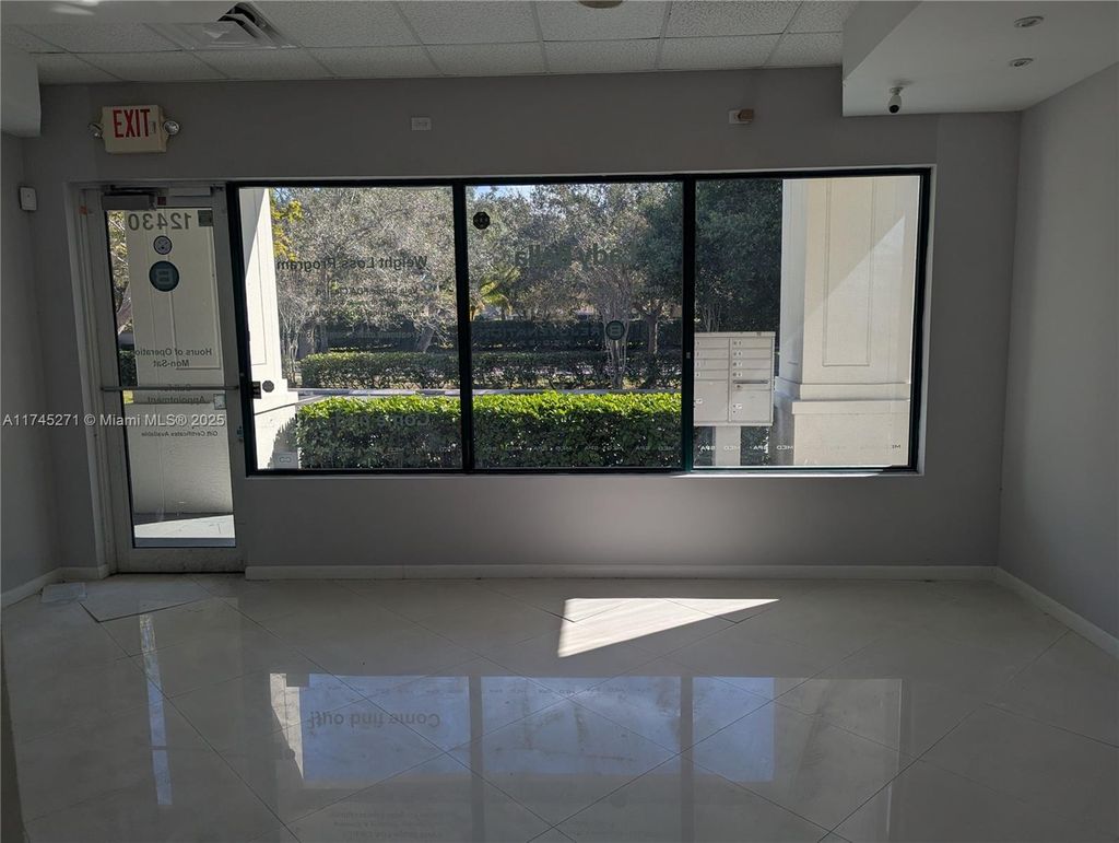 Photo of 12430 W Atlantic Blvd #12430, Coral Springs, FL 33071 (MLS # A11745271)