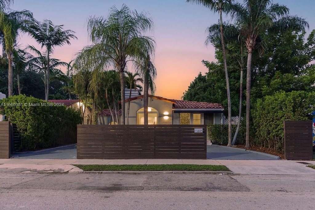 A tranquil oasis in historic Palm Grove, updated with a fresh modern new look. Spacious living areas highlight this home along with double primary suites, both with ample closet walk-in closets, seating area & private baths. Ceiling height, natural light and modern updates make this a quintessential 1940s home. 3rd bedroom, ideal as guest room or office. Live indoor & out with spacious family room that opens to covered patio seating area ready for an outdoor television. Lush landscaping, saltwater pool & outdoor kitchen creates the ultimate entertainment home. Modern updates throughout. Circular driveway with space for up to 3 vehicles. Steps from the all the attractions of Mimo.