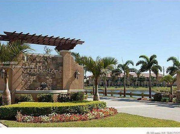 Welcome to this spacious and beautifully maintained 3-bedroom, 2-bathroom located in the highly desirable gated community of Cobblestone. Featuring an open-concept layout with high ceilings and abundant natural light, this home offers a modern kitchen with granite countertops, stainless steel appliances, and wood cabinetry. The primary suite includes a large closet and an ensuite bath with dual sinks and a soaking tub. Convenience of an attached garage, in-unit laundry, and a private balcony. The community offers resort-style amenities including a pool, clubhouse, fitness center, and playground. Ideally located near I-75, major shopping centers, restaurants, and top-rated schools.