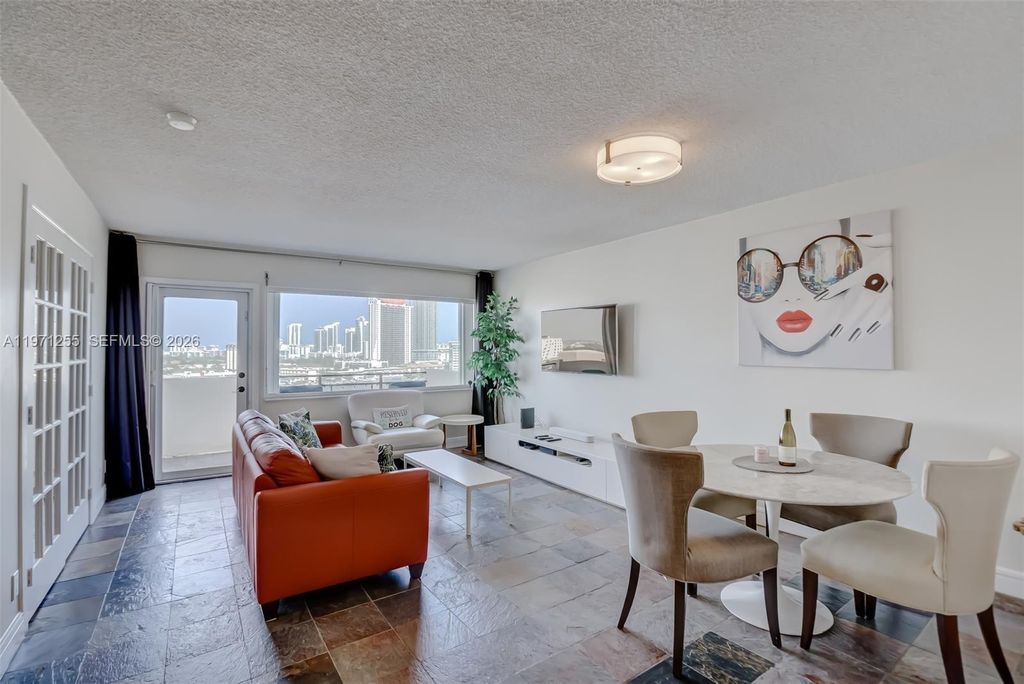 Photo of 401 Golden Isles Dr #1101, Hallandale Beach, FL 33009 (MLS # A11971255)