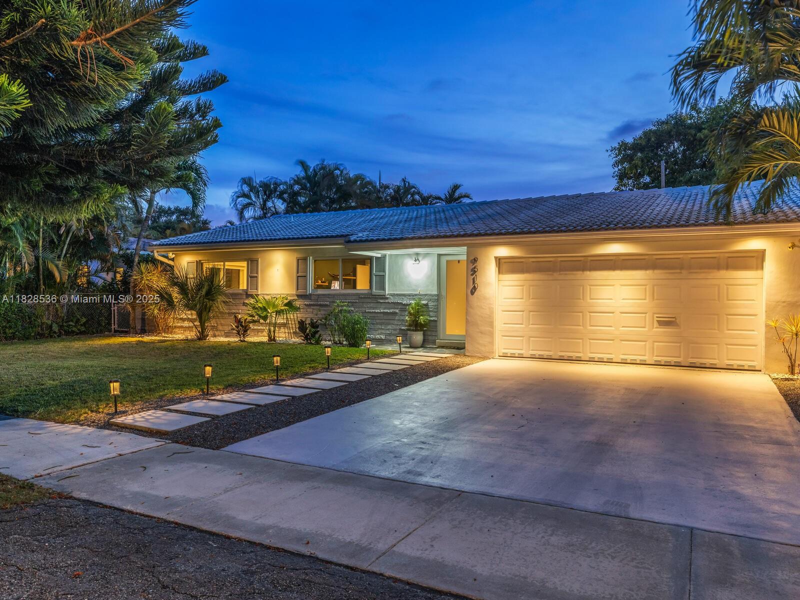 Welcome to The Island Pine Hideaway! Live large with three bedrooms, two full baths, ~1,800 SF of spacious interiors, and a massive two-car garage on a large 8,305 SF lot, just three blocks to Downtown Miami Shores. Enter through a welcoming foyer into the smartly-updated open-flow living with eat-in peninsula bar kitchen and wood-beamed ceiling dining room, opening through French doors to the covered entertainment patio and sprawling gardens. All bedrooms are tucked away in the south wing, including the main ensuite retreat with walk-in closet and spa-like bath, plus two bright guest rooms. Great features: impact windows-doors, recessed lighting, great entertainment and relaxation areas inside and out, plus room for a pool. All in a fantastic non-flood zone location on a quiet cul-de-sac!