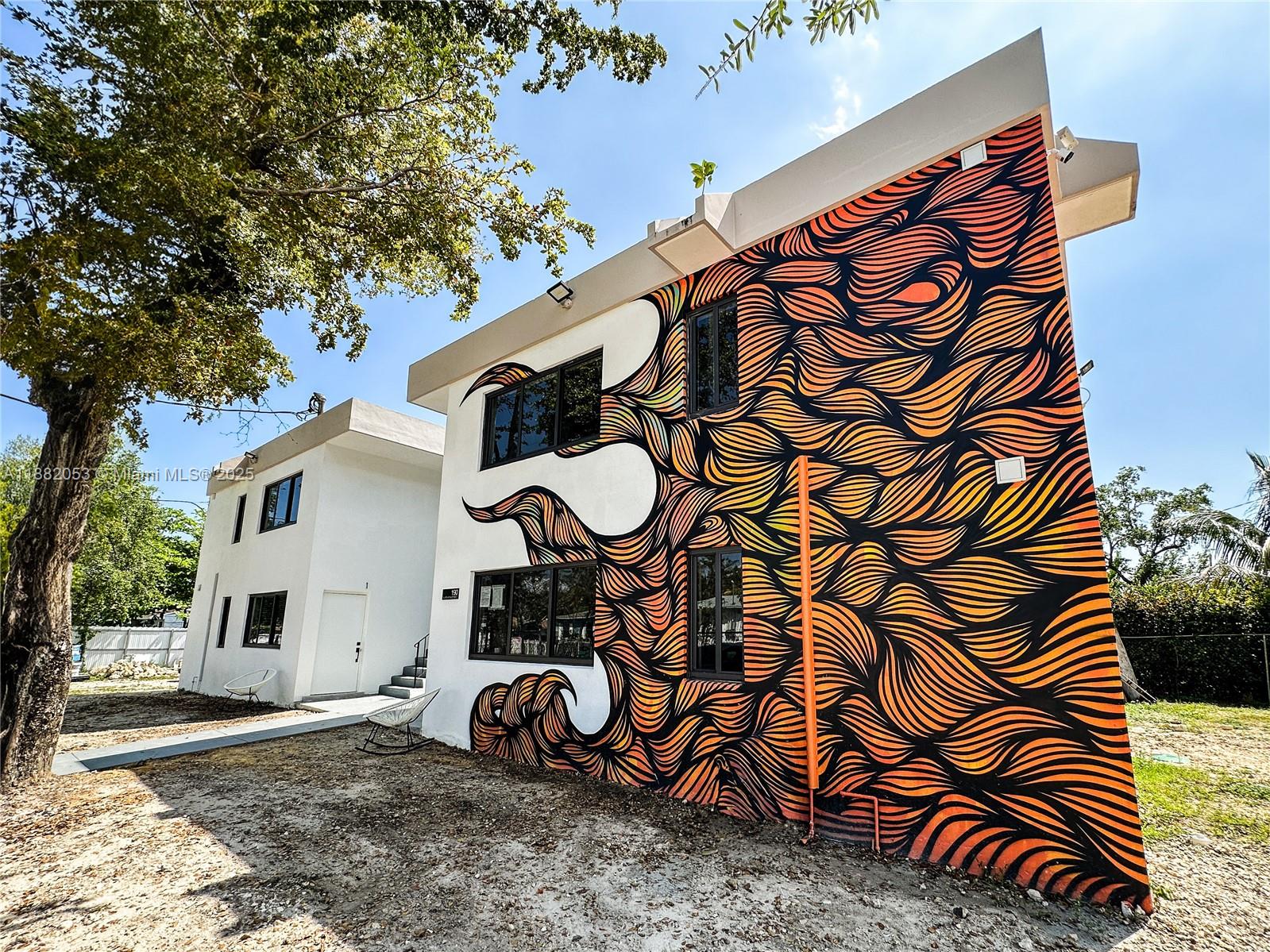 Light-filled corner apartment in Miami's trendy Little River District. Originally constructed in 1970, the concrete structure has recently undergone a 30-month modernization process, including the installation of new plumbing and drainage systems, electrical wiring, central AC, kitchens, bathrooms, impact windows, steel entry doors, and a laundry room. Security measures have been enhanced with the installation of cameras and LED lighting on each side of the property. Wifi and on-site parking available.