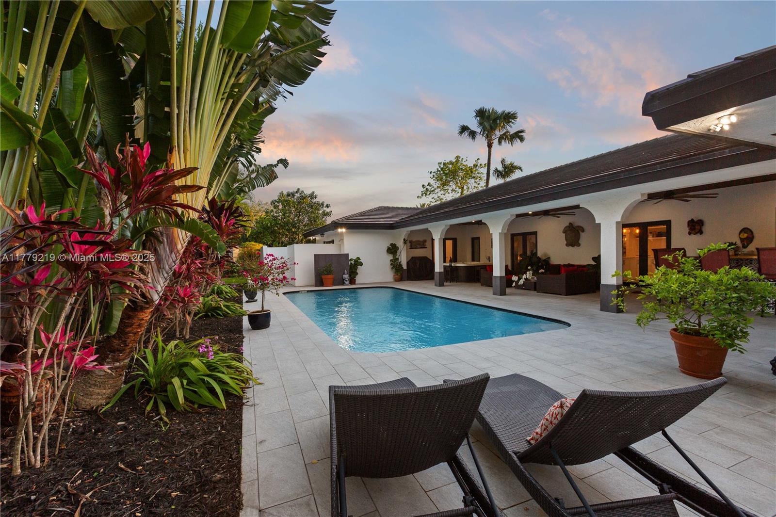 Modern 4 bedroom, 4 bath Pinecrest home, remodeled in 2020 on a “true” half-acre lot on a cul-de-sac with circular driveway & plenty parking. Lots of space to add a tennis/pickle ball court. High ceilings & impact windows & doors. Large kitchen with quartzite countertops, oversized island and seating, with all new stainless-steel appliances. One-of-a-kind professionally designed wine room with commercial refrigeration that seats up to 8 people. Spacious master suite and master bath with two generous bedrooms with accompanying bathrooms & walk-in closet. Large playroom (or 5 bedroom) and 4th bedroom/office which opens to the pool & garden. Inviting pool with jacuzzi, exterior bar, Bose sound system. 2 car garage with excellent storage. This property is not in a flood zone.