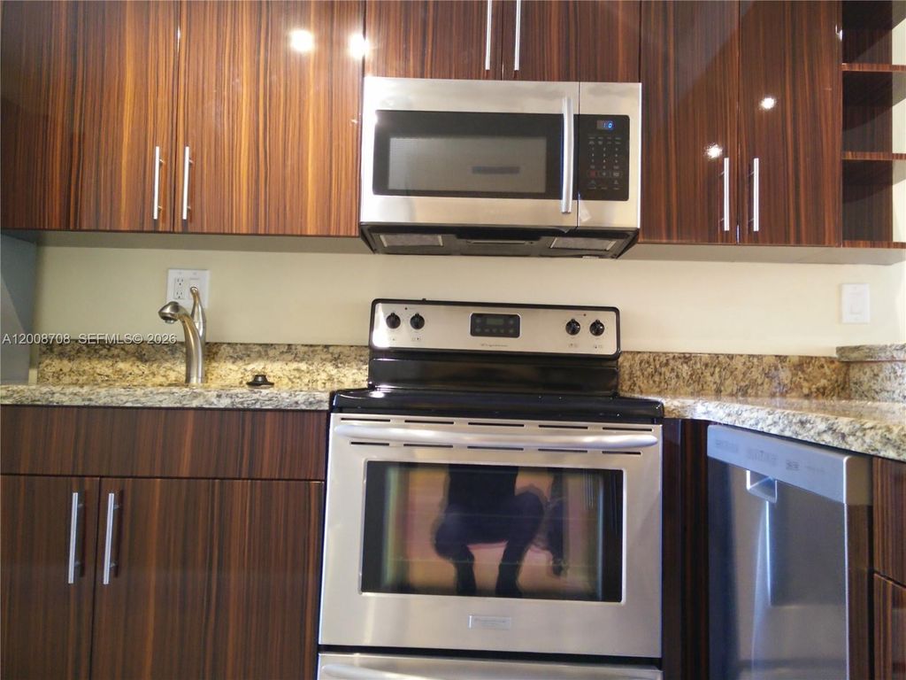 Photo of 3285 Foxcroft Rd #E107, Miramar, FL 33025 (MLS # A12008708)