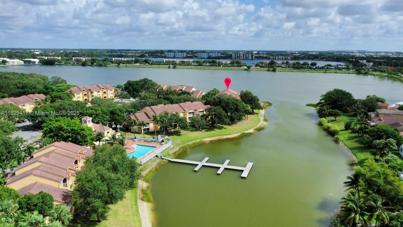 Enjoy this spectacular view from the comfort of our living room. Property has wood style flooring & stainless steel appliances in the kitchen. Ample living room and dining area. Property has a screen balcony, a storage room, and access to Canal/Lake. Recently updated bathroom with modern vanity and lighting and the marble look tile flooring. This 1200+ 2 bedrooms 2 full bathrooms apartment is ready to be rented or future home. Kitchen has brand, new stove, dishwasher & microwave. The unit was also updated with brad new the front loading LG washer and dryer.