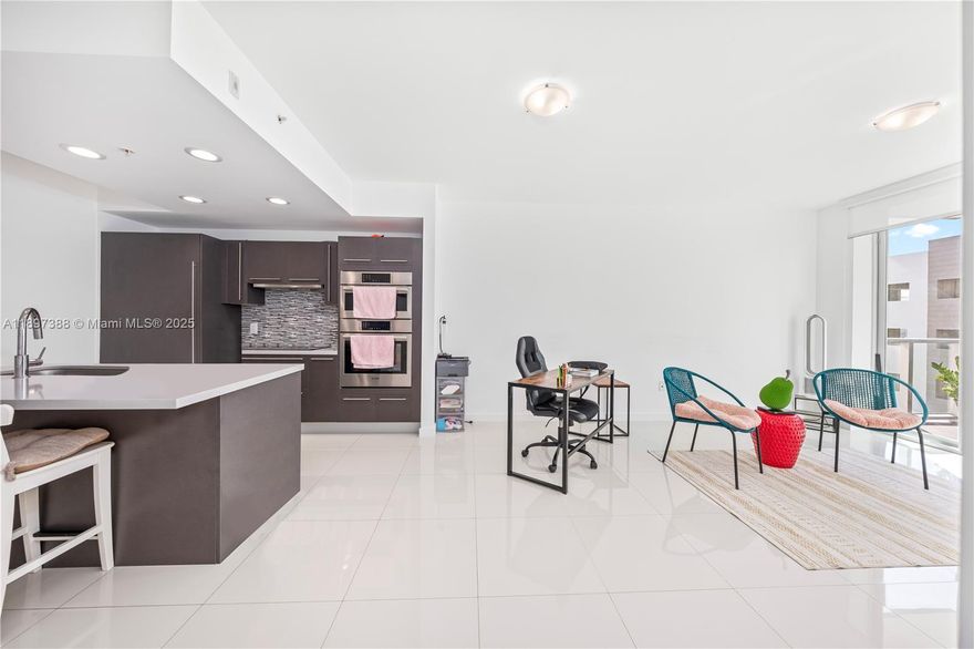 Discover an exceptional opportunity to own a beautiful apartment in the heart of  Doral. This spacious 1-bedroom plus den, 2-bathroom residence features soaring ceilings, elegant contemporary finishes, and a thoughtfully designed open-concept layout that suits modern living. The den offers flexible use as a home office or guest space, enhancing both comfort and value. The gourmet kitchen is equipped with premium appliances and sleek cabinetry, ideal for everyday living. Residents enjoy resort-style amenities including a state-of-the-art fitness center, resort-style pool, sauna, and clubhouse—elevating  lifestyle. One assigned parking and a prime location near top-rated schools, this property offers the perfect combination of urban convenience, lifestyle, and long-term value.