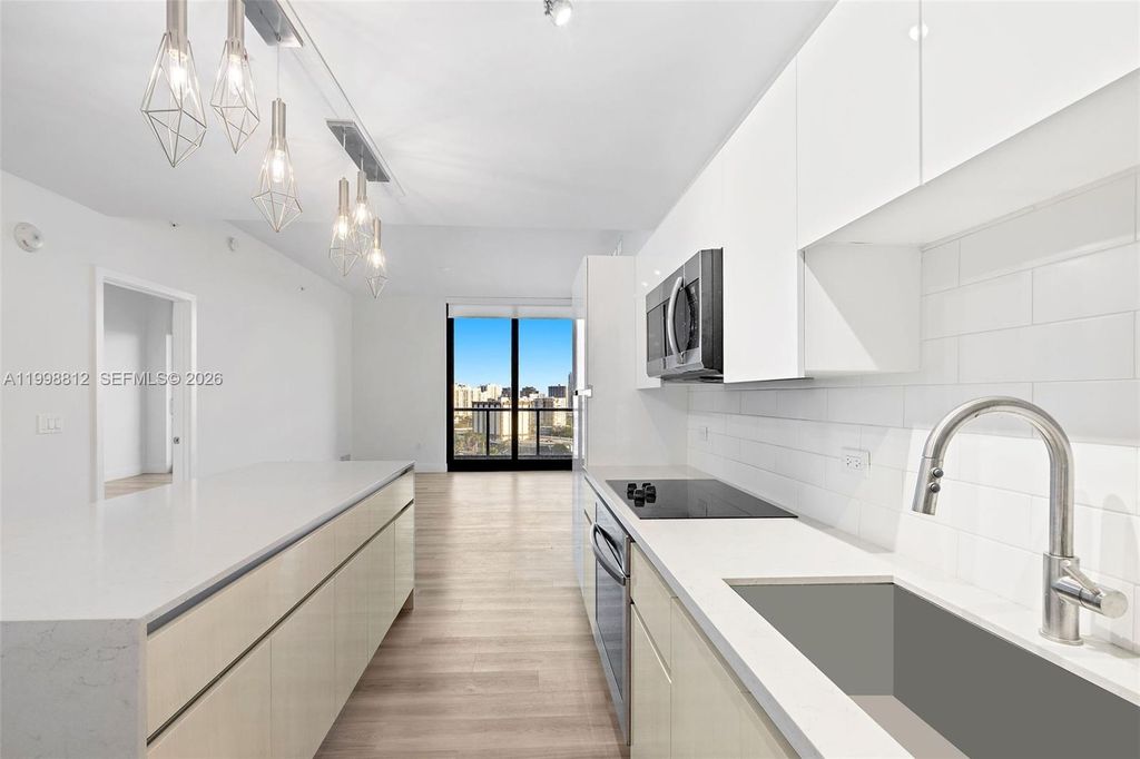 Photo of 101 Diplomat Pkwy #1004, Hallandale Beach, FL 33009 (MLS # A11998812)